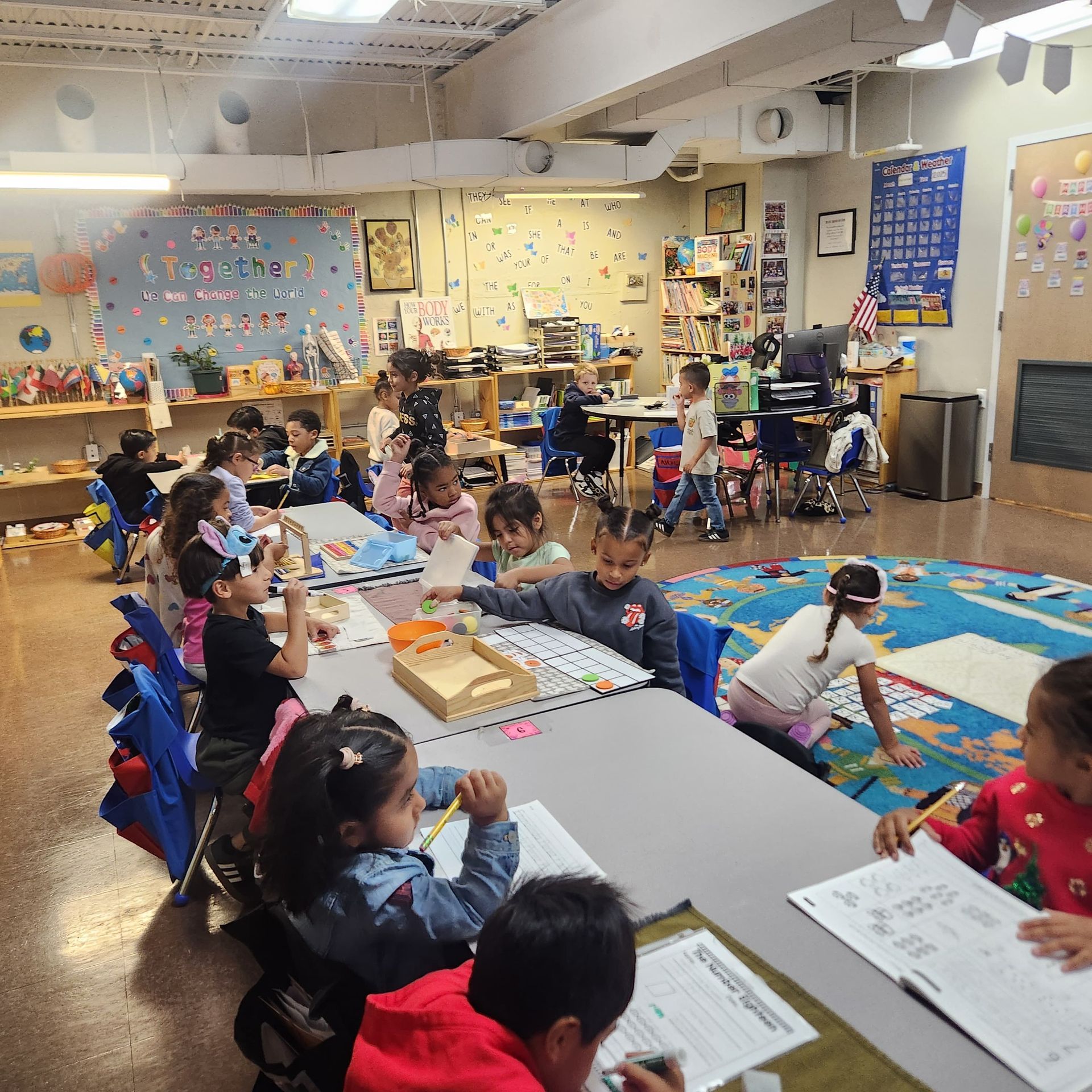 Children working together at classroom tables