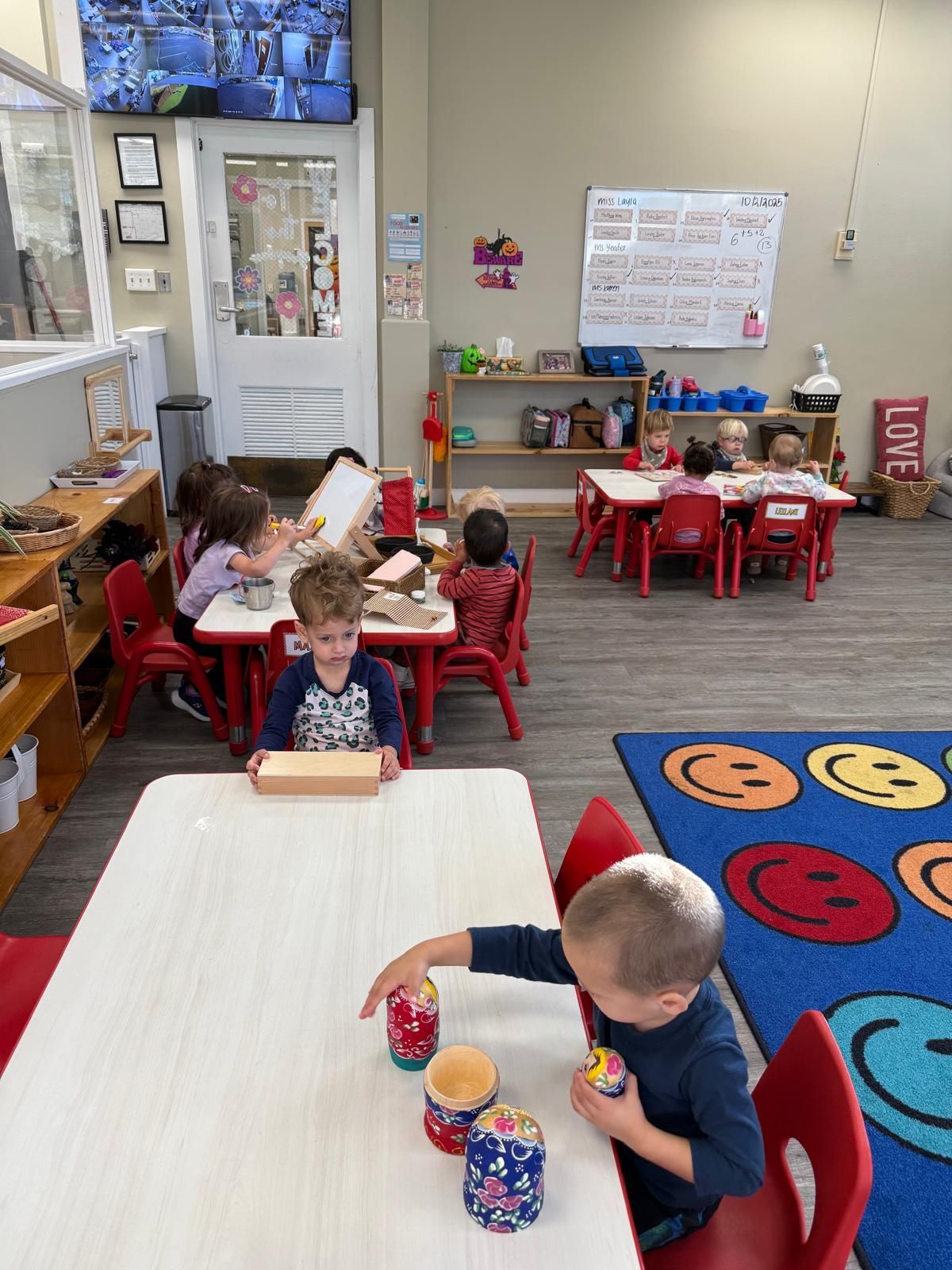Young children practicing fine motor skills