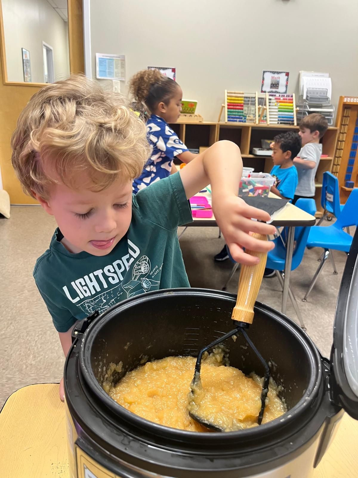 Toddler pouring ingredients