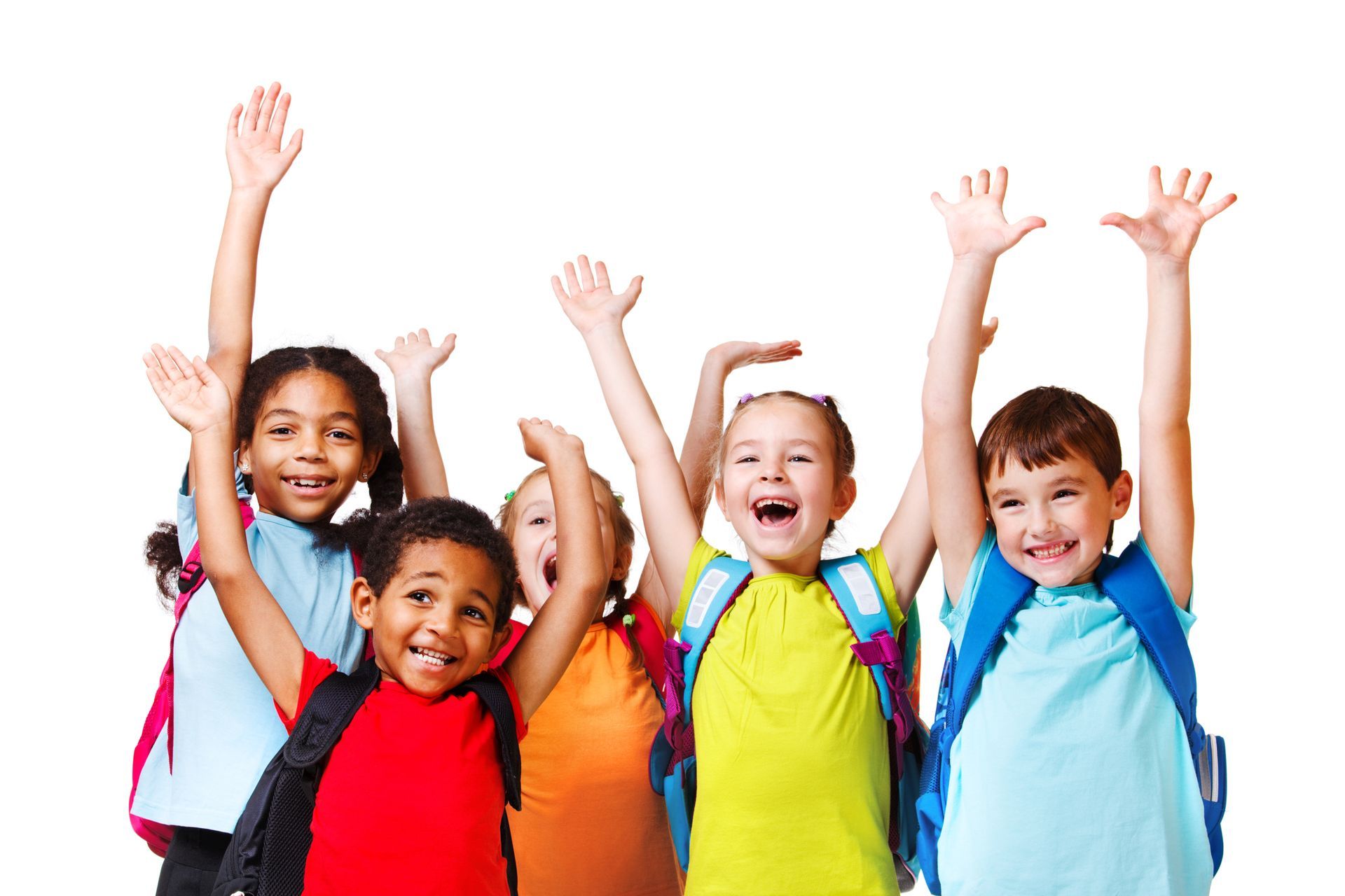 A group of children with backpacks are raising their hands in the air.