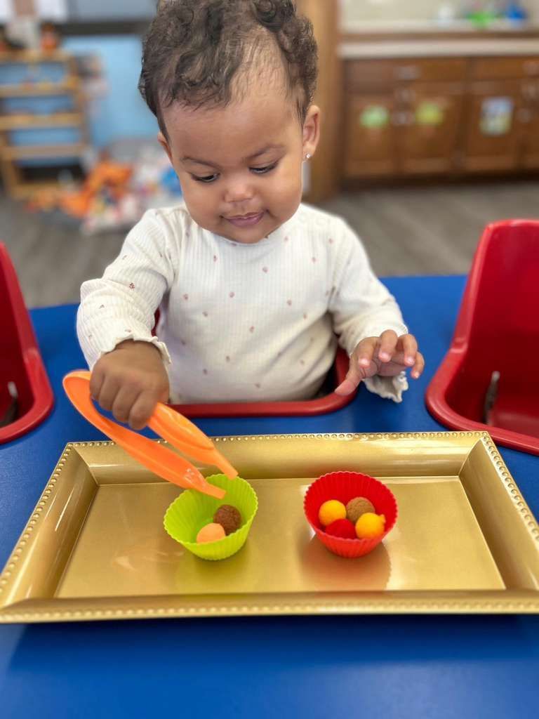 Child practicing tongs