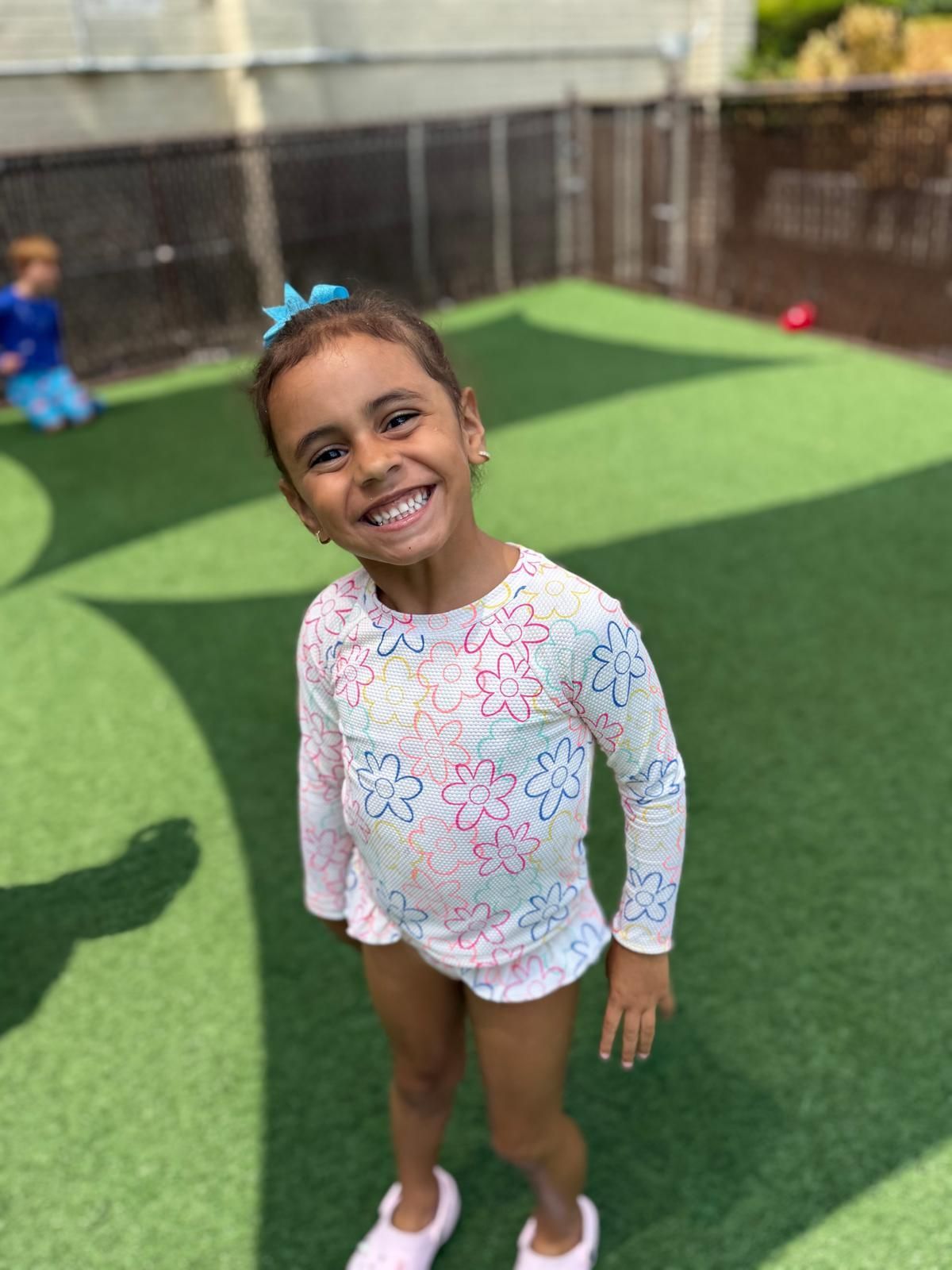 A table with toys and an abacus on it in a play room.