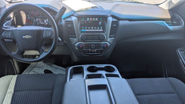Interior of a Chevrolet SUV showing the dashboard, steering wheel, and center console.