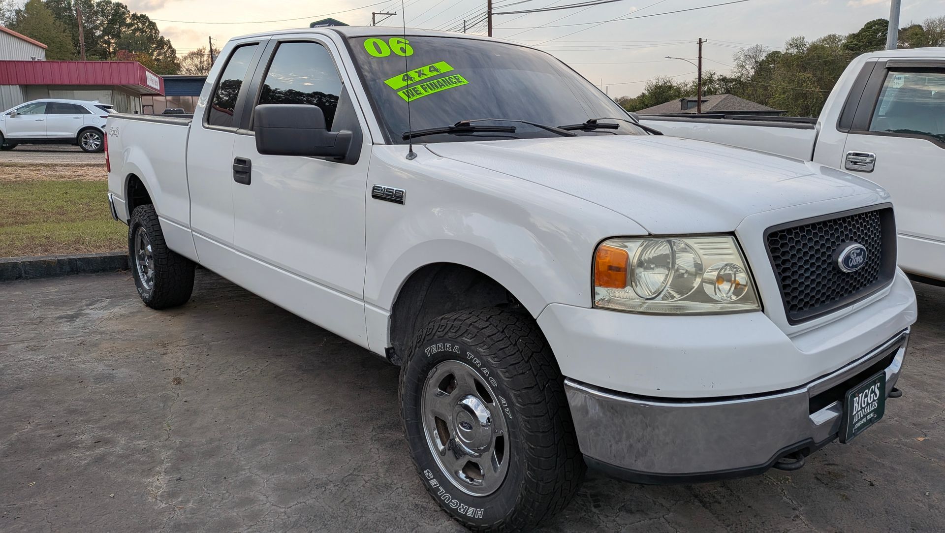 White 2006 Ford F-150 truck parked outdoors, with a 