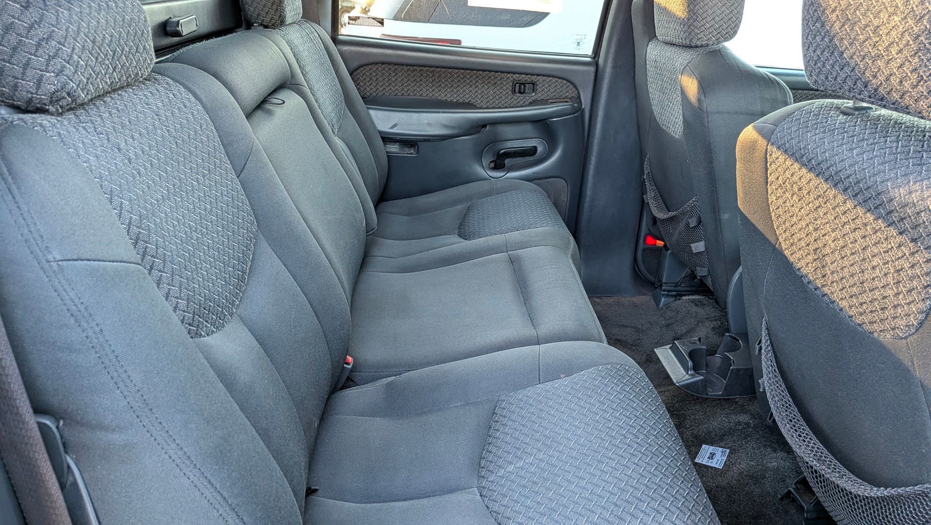 Grey fabric truck backseat.