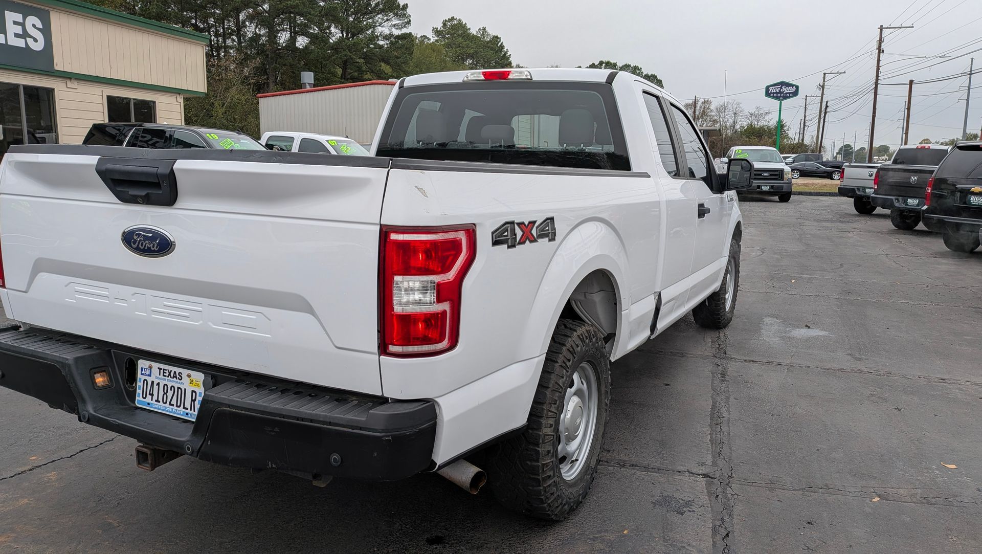White Ford F-150 pickup truck with 