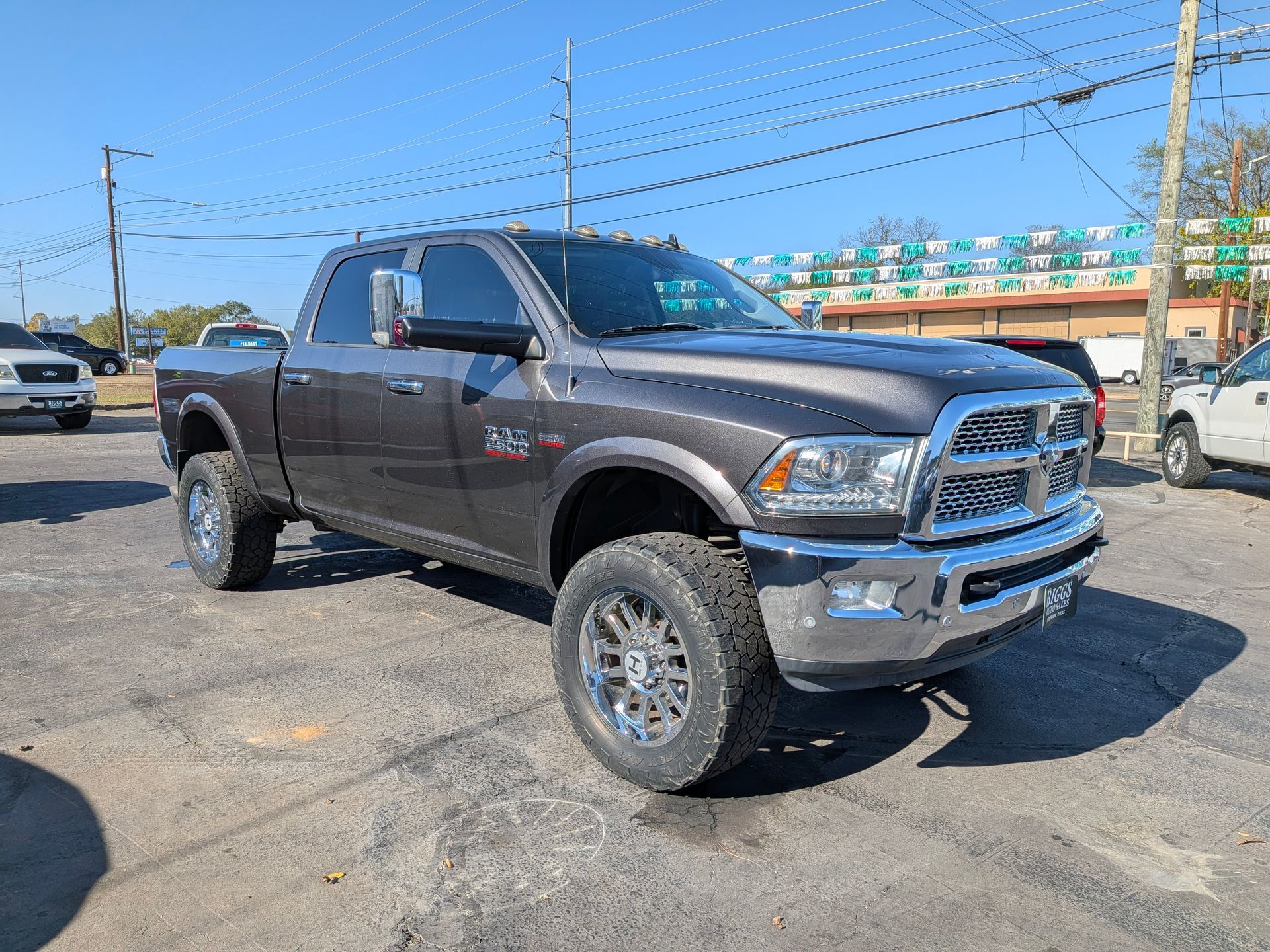 Gray Ram 2500 pickup truck parked outside on a sunny day.