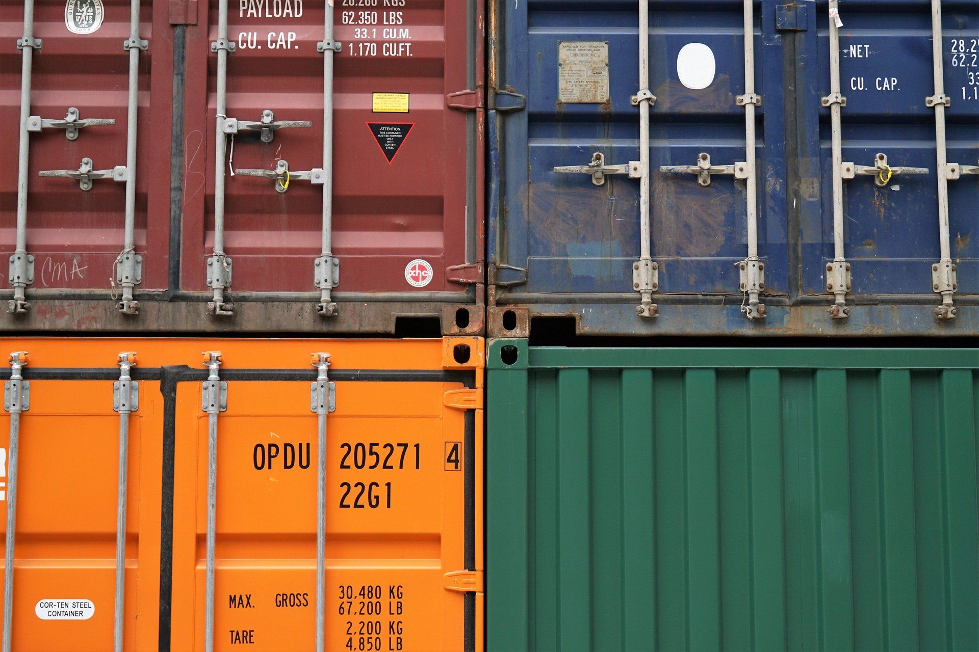 Several shipping containers are stacked on top of each other