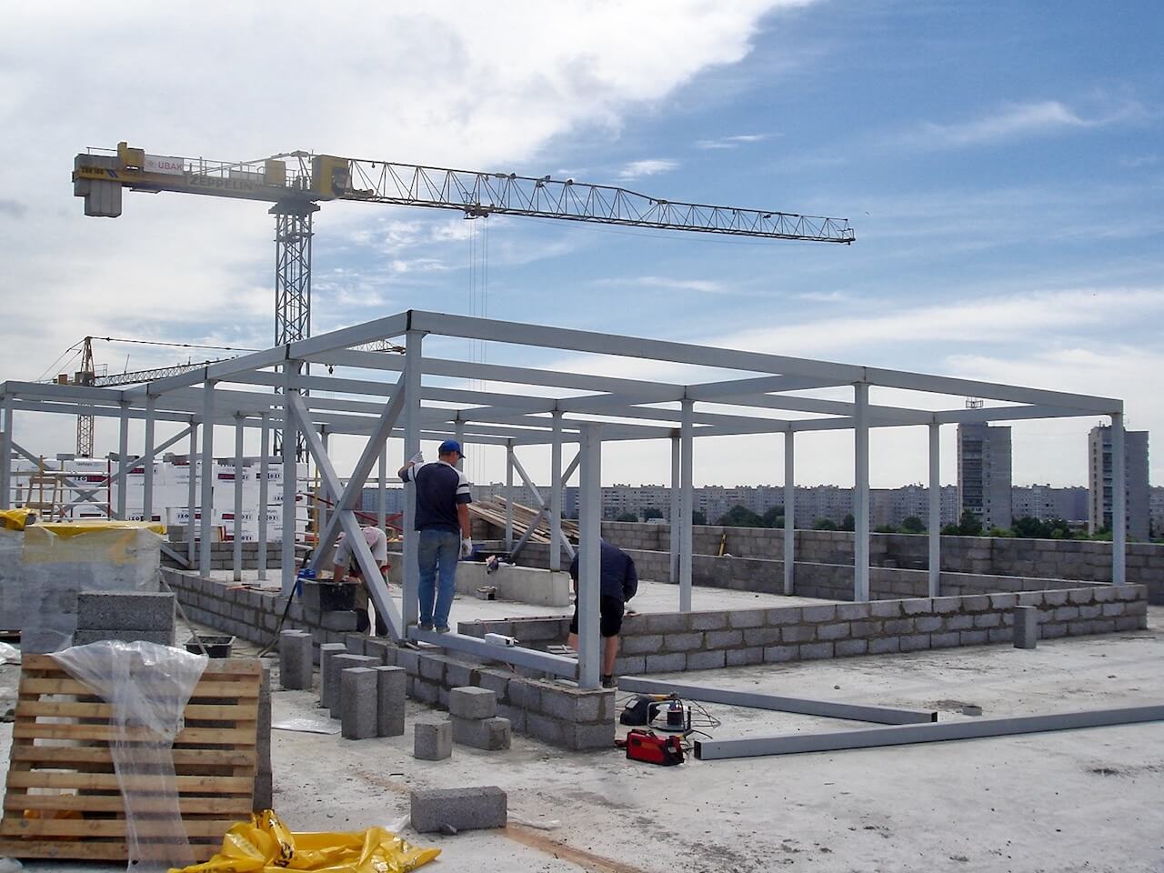 A construction site with a crane in the background