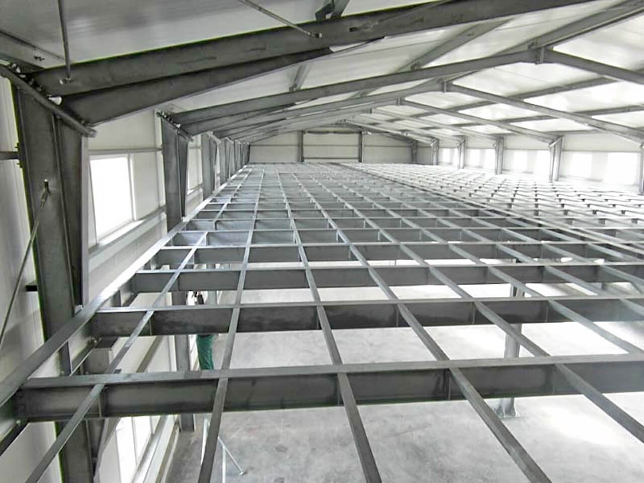 The inside of a building with a lot of metal beams