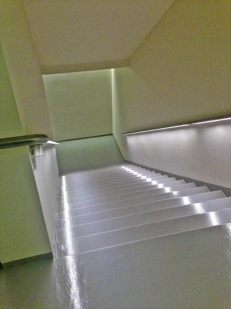 A set of stairs that are lit up in a building