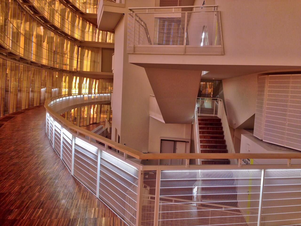A large building with stairs leading up to the second floor