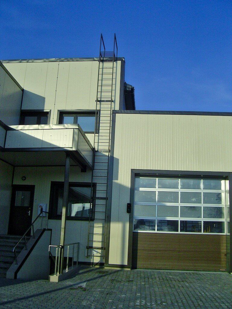 A building with a metal ladder on the side of it