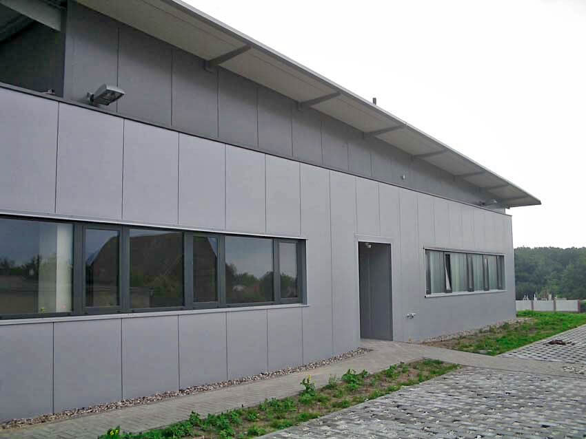 A large building with a lot of windows and a door