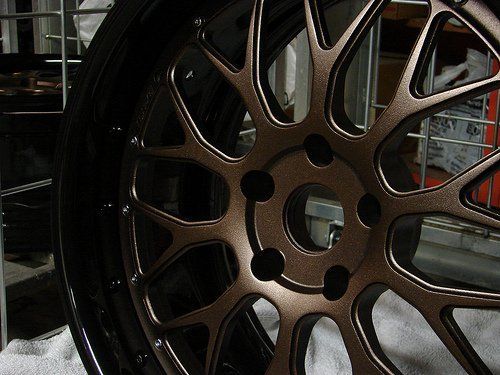 A close up of a wheel on a white cloth