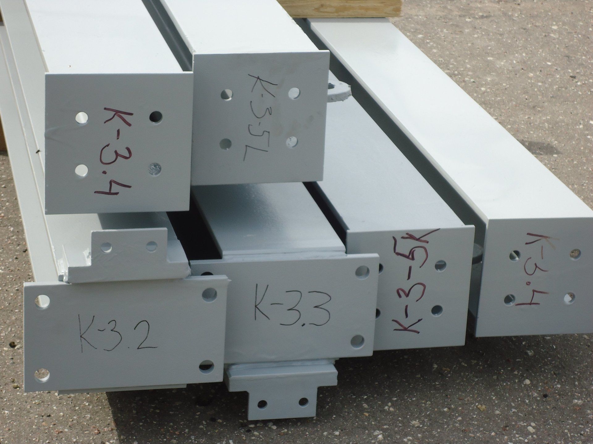 A bunch of pieces of metal with k-33 written on them