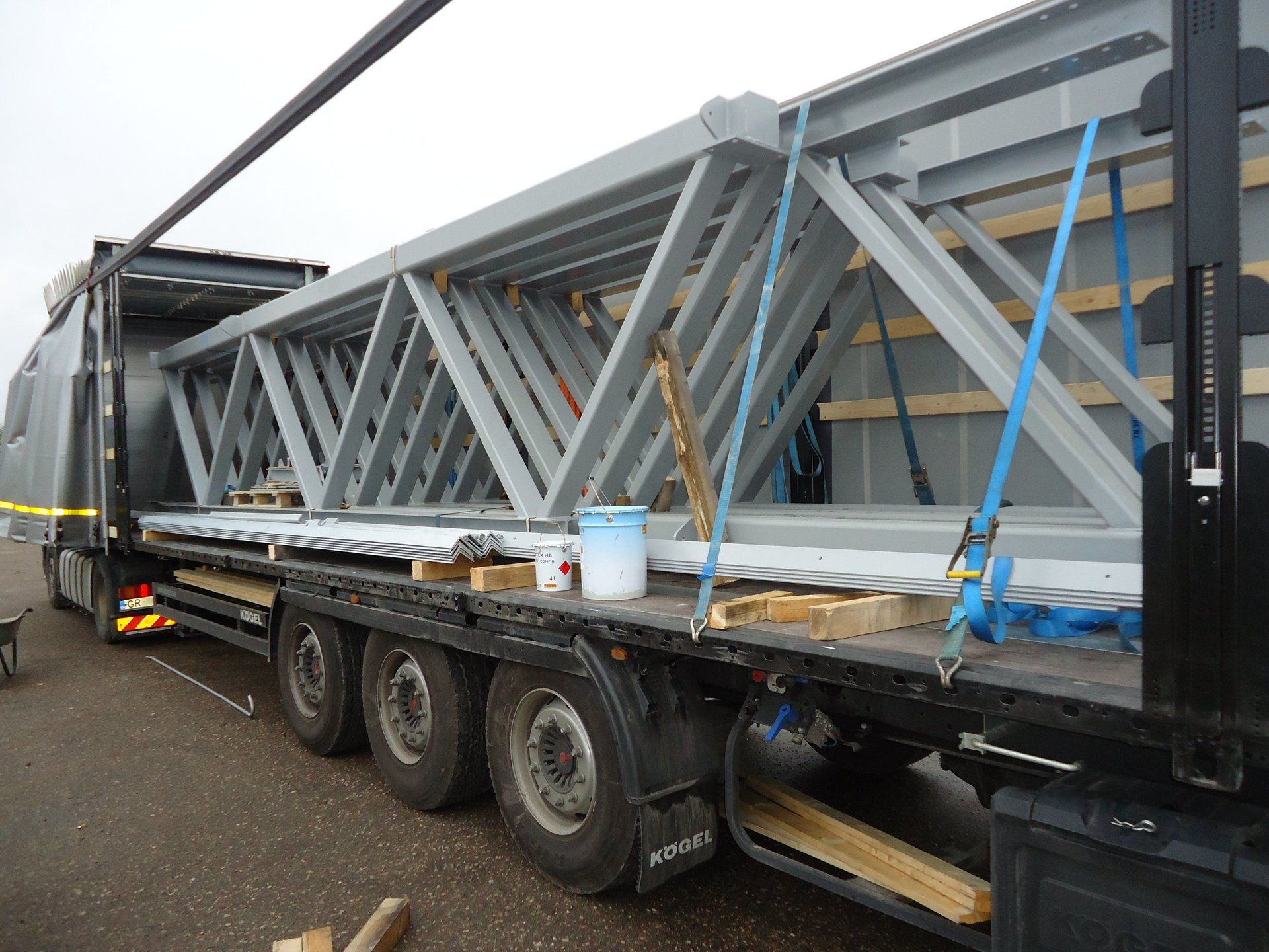 A truck with a large metal structure on the back of it