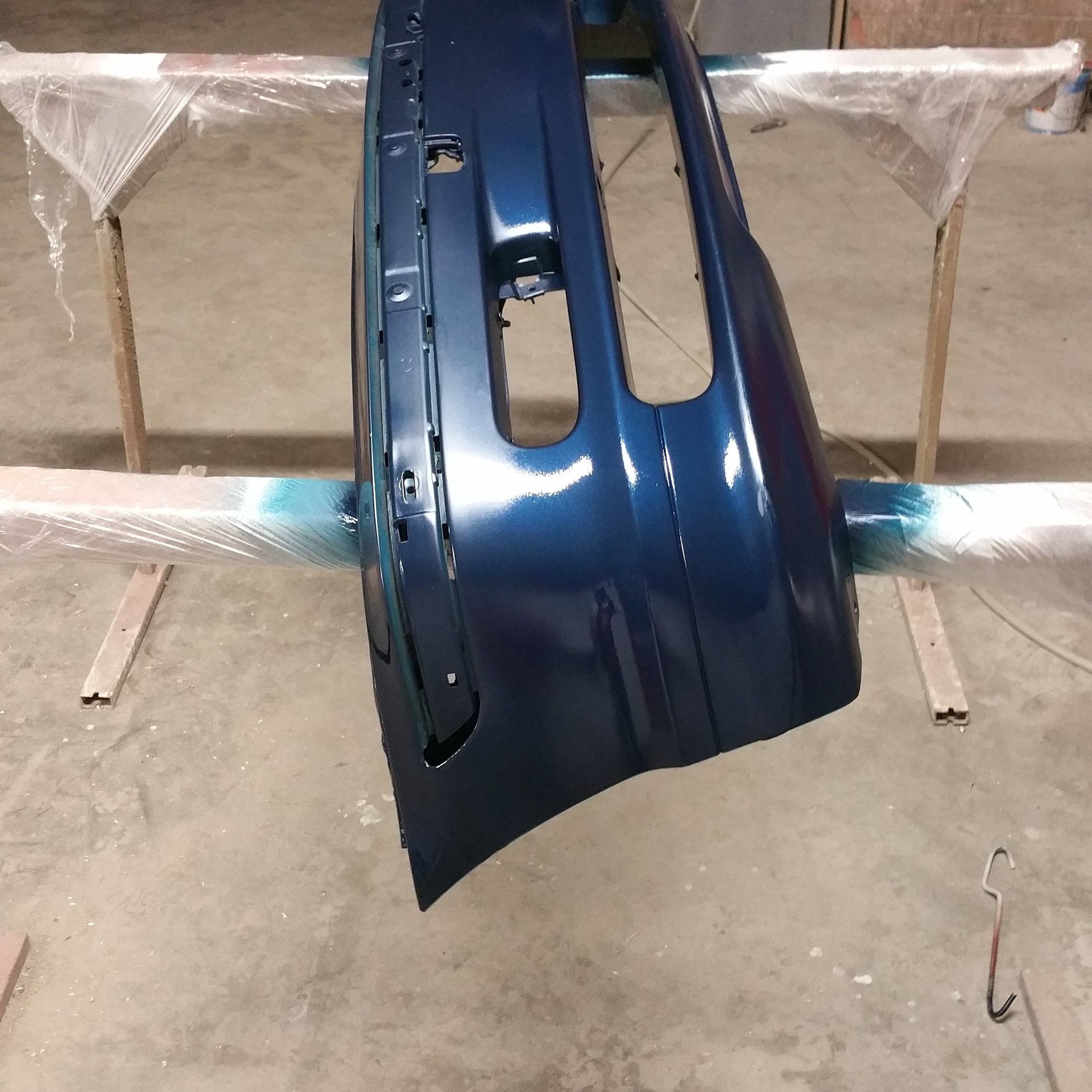 A blue bumper is sitting on a wooden stand