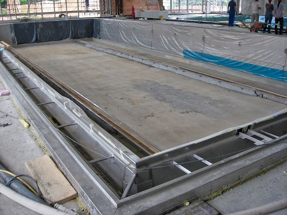 A swimming pool is being built in a building