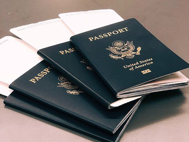 Image of three passports on table
