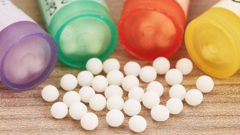 Empty pill bottles and little white balls