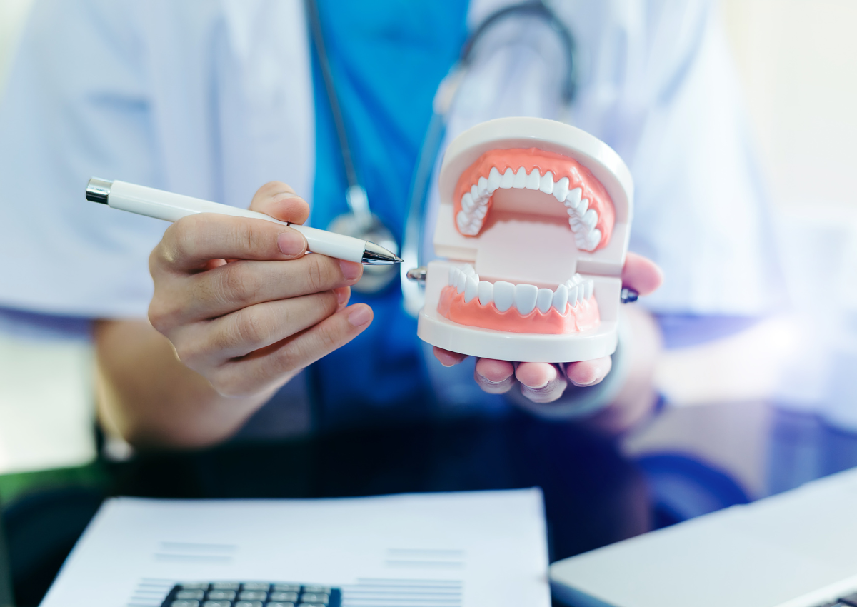 A clear plastic mouth guard is sitting on a metal surface
