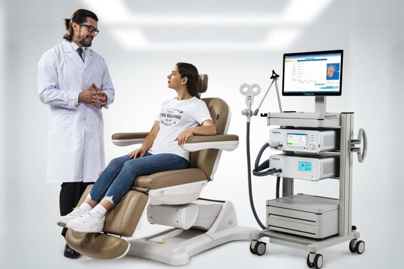 Doctor consulting with a patient in a medical examination room next to medical equipment.