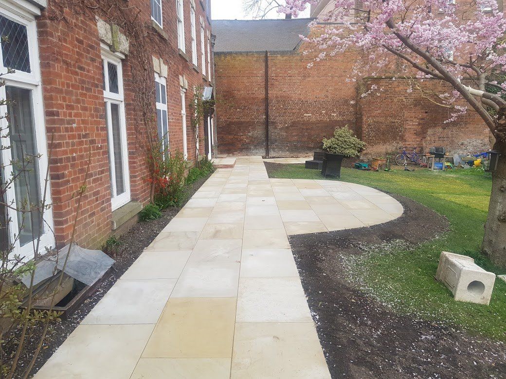 Sandstone paving near a garden