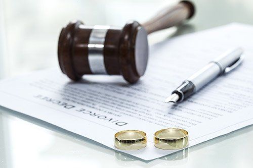 Divorce Attorney — Divorce Decree Form with Rings in Massillon, OH