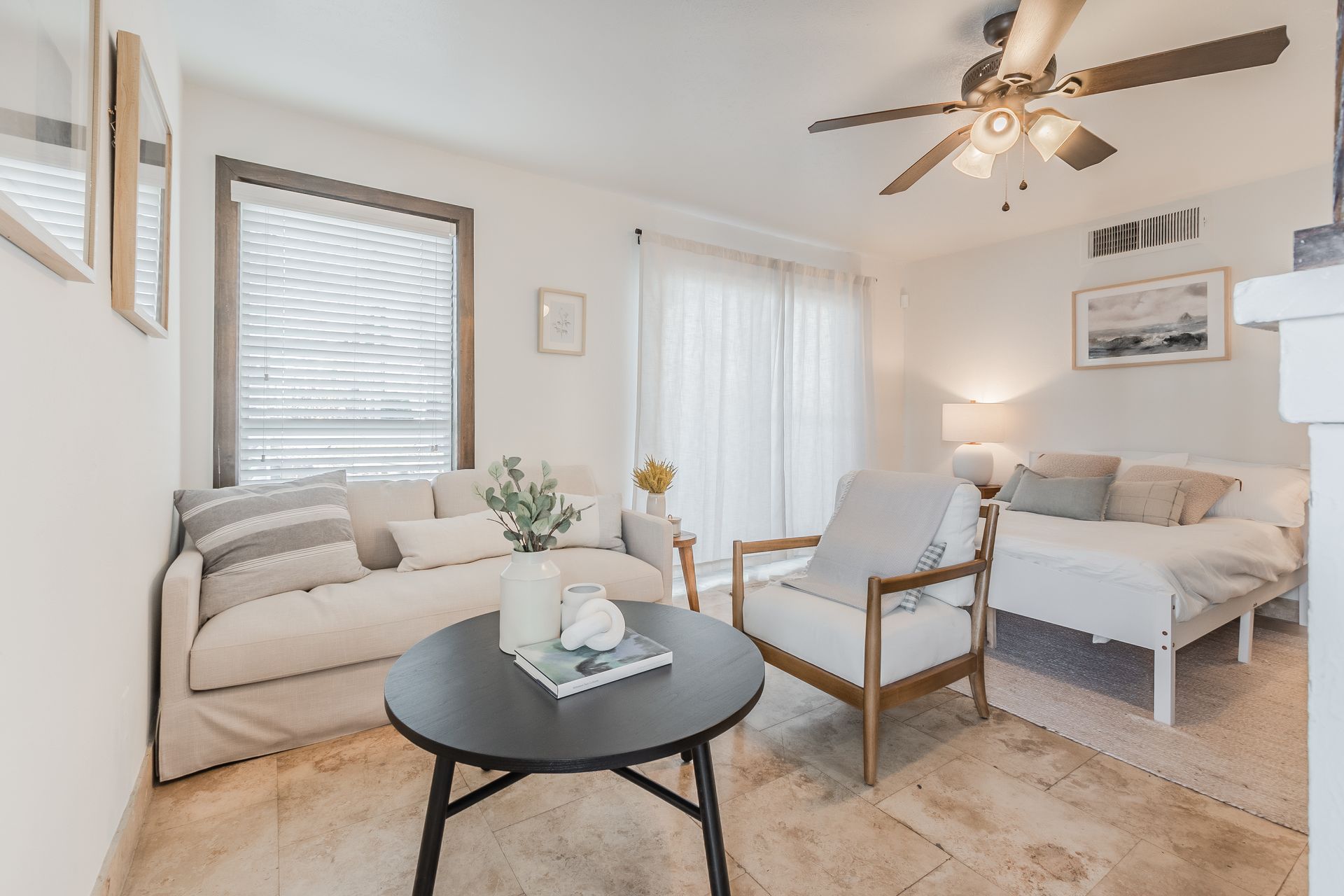 Photo of a living room area with plenty of natural lighting