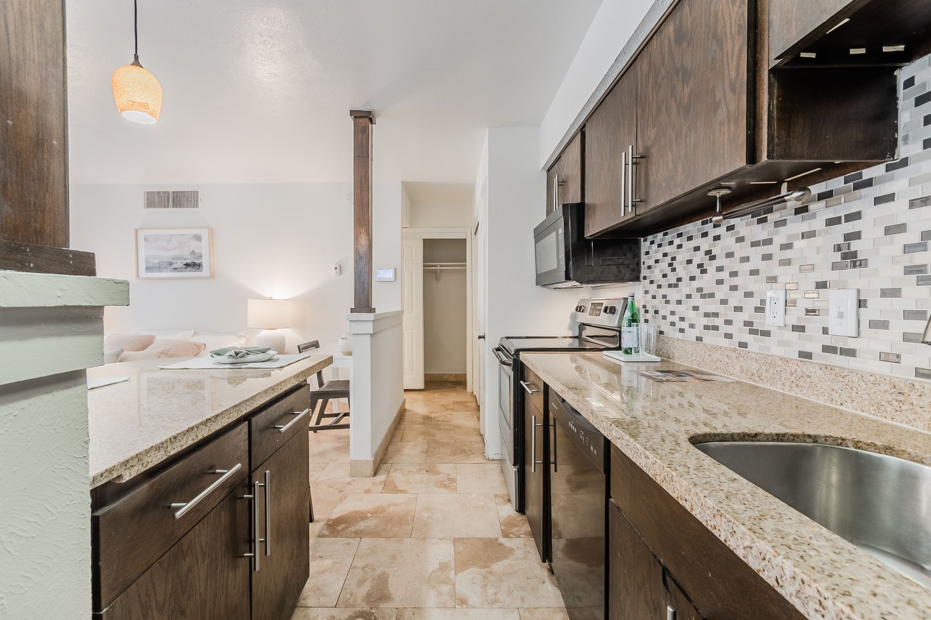 Photo of a kitchen with the dining area in the background