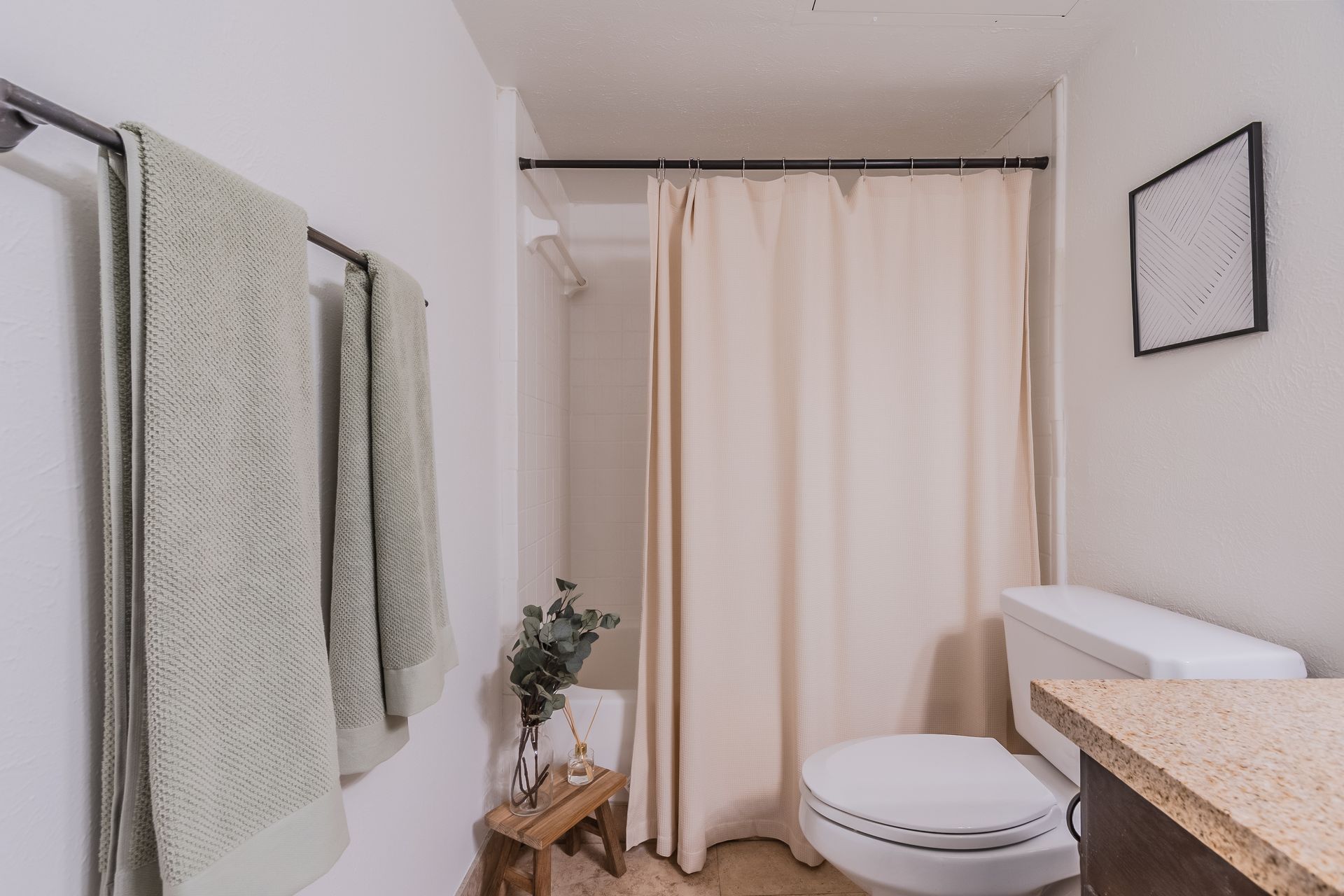 Photo of a bathroom with a bathtub/shower combo