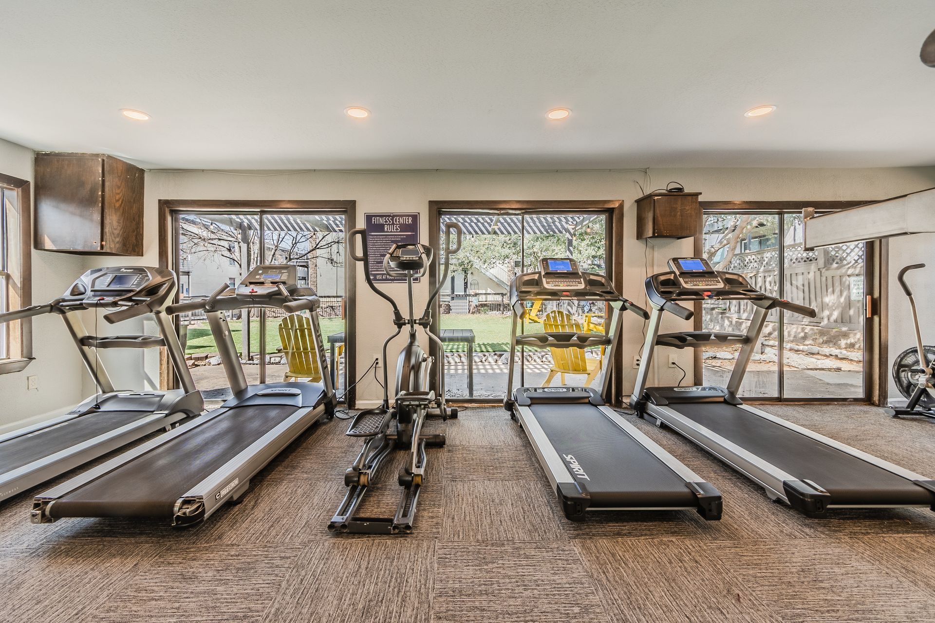 Photo of a community gym showing treadmills and other equipment