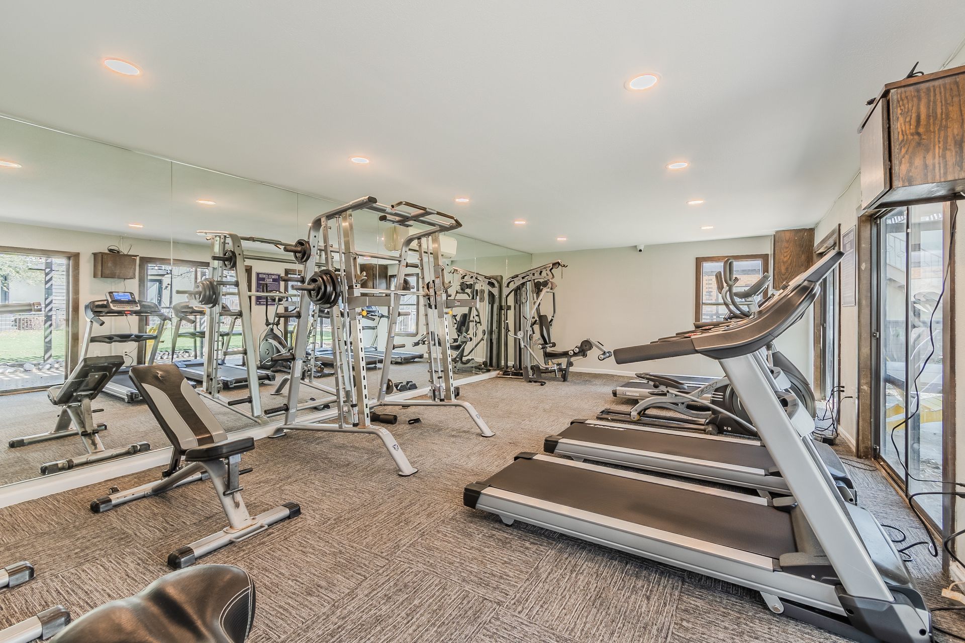 Photo of a community gym showing various kinds of equipment