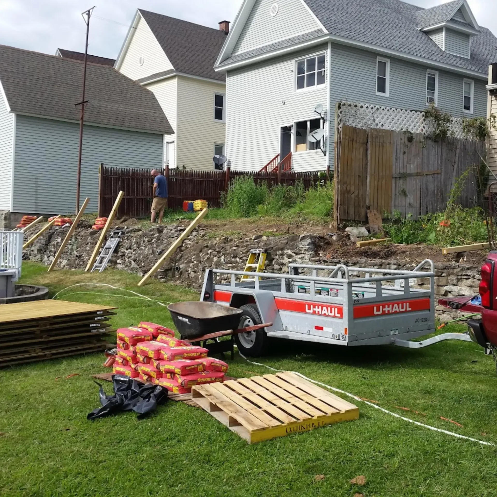 CK Maintenance LLC - A u-haul trailer is parked in a grassy field