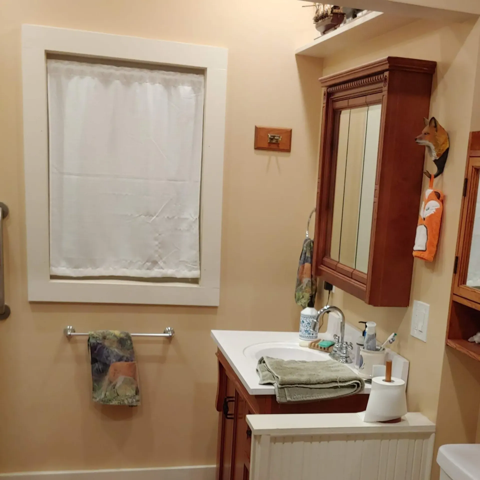Ck Maintenance - A bathroom with a sink a mirror and a window