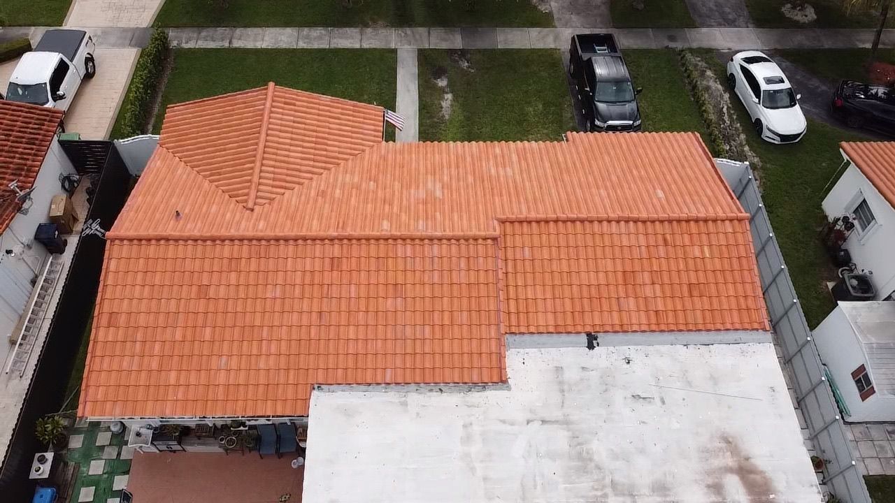 An aerial view of a house with a tiled roof.