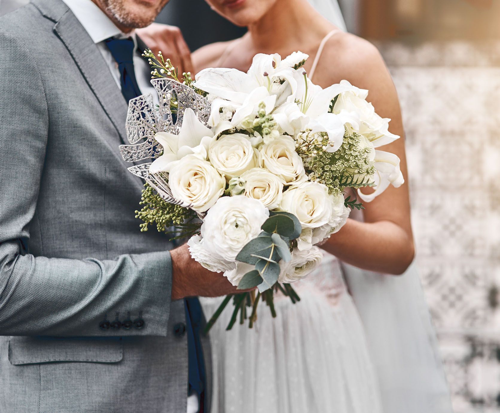 Bride and Groom Holding a Bouquet — Montrose, PA — Sunset Floral