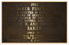 Bronze plaque: Baker Funeral Home, erected in 1952, honoring Shirley and Charles Baker's service since 1923.