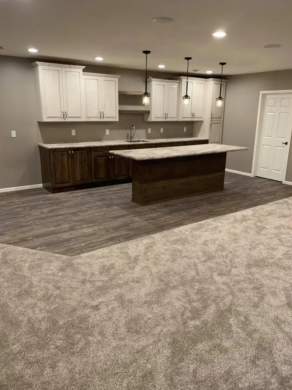 There is a large island in the middle of the room.