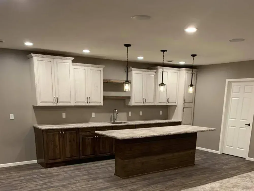 There is a large island in the middle of the kitchen.