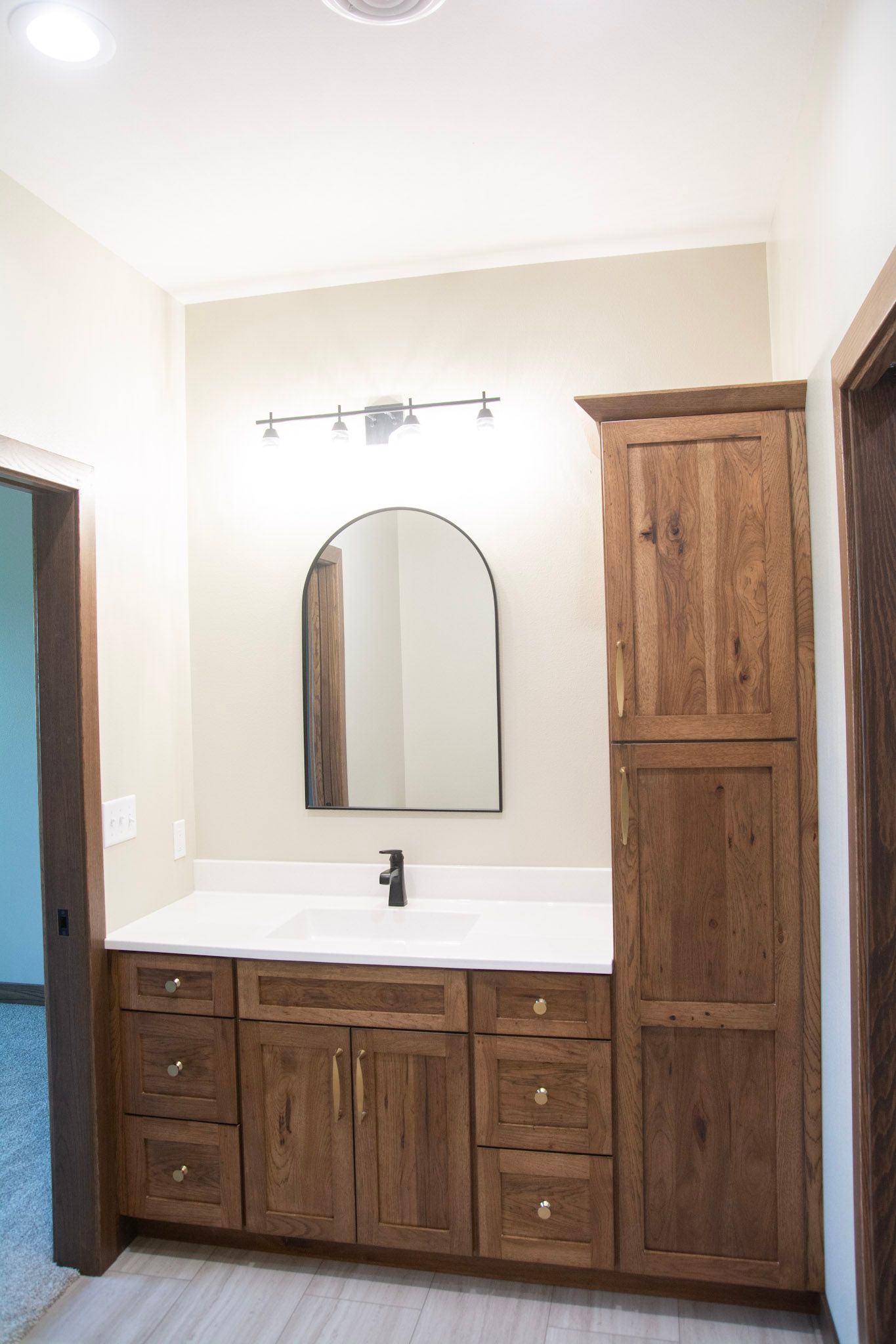 A bathroom with a toilet , sink , bathtub and shower.