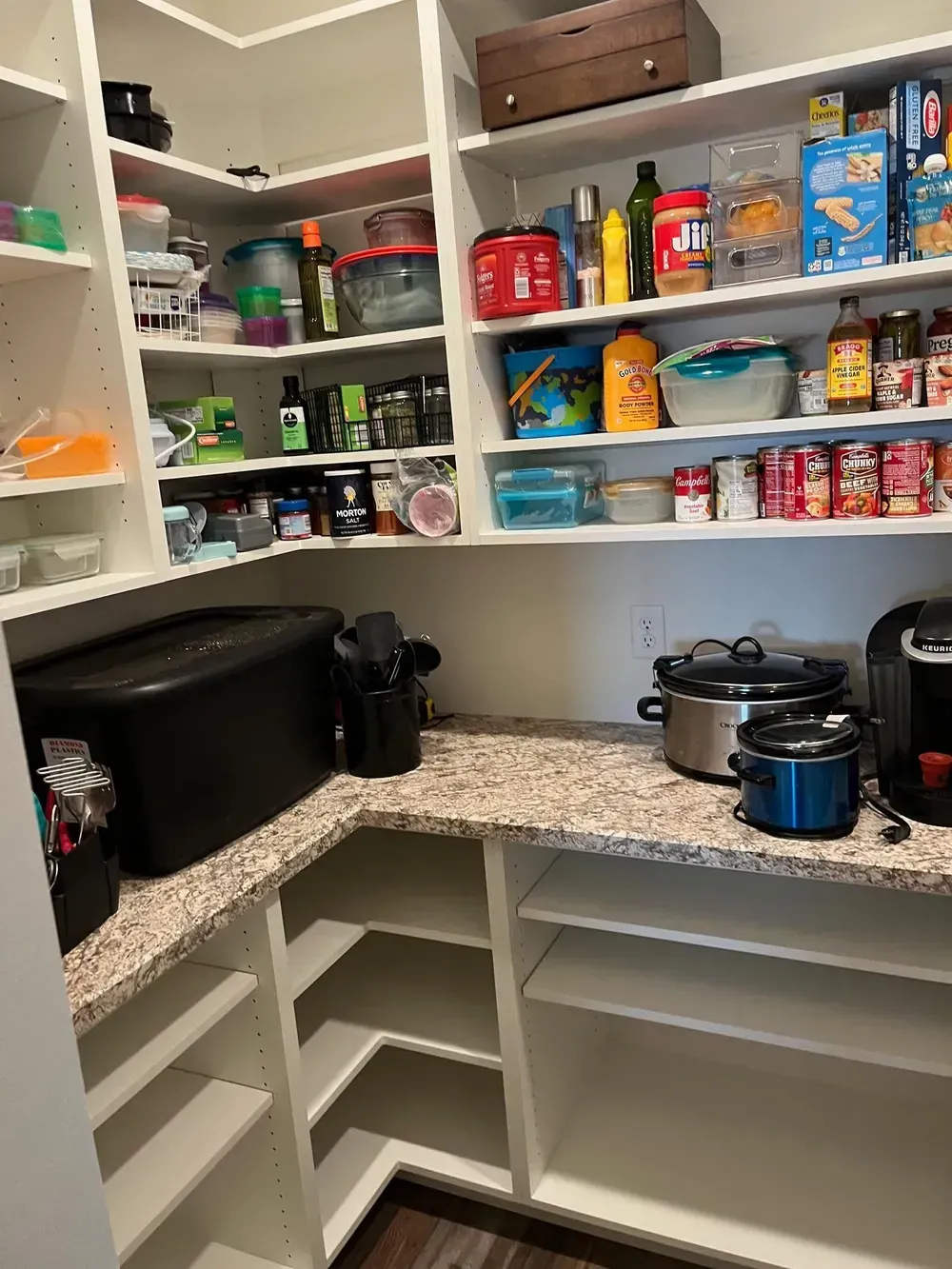 A pantry filled with lots of food and appliances.