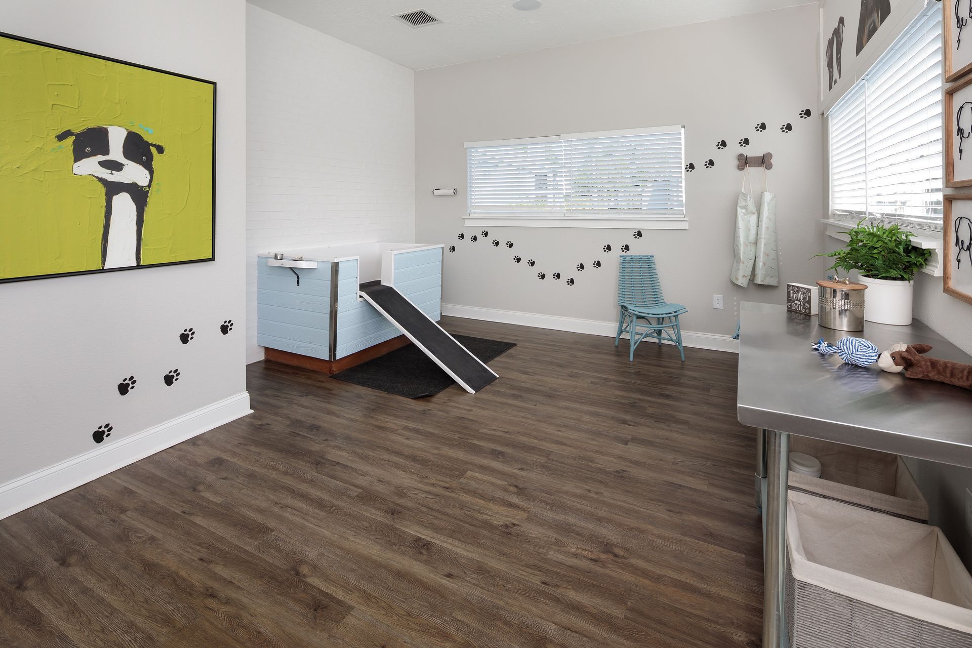 There is a picture of a dog on the wall in the room.