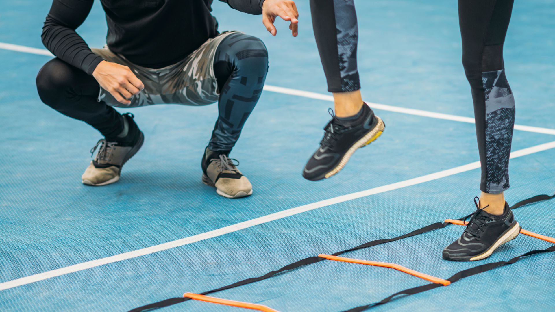 Personal trainer in Overland Park assisting with agility drills 