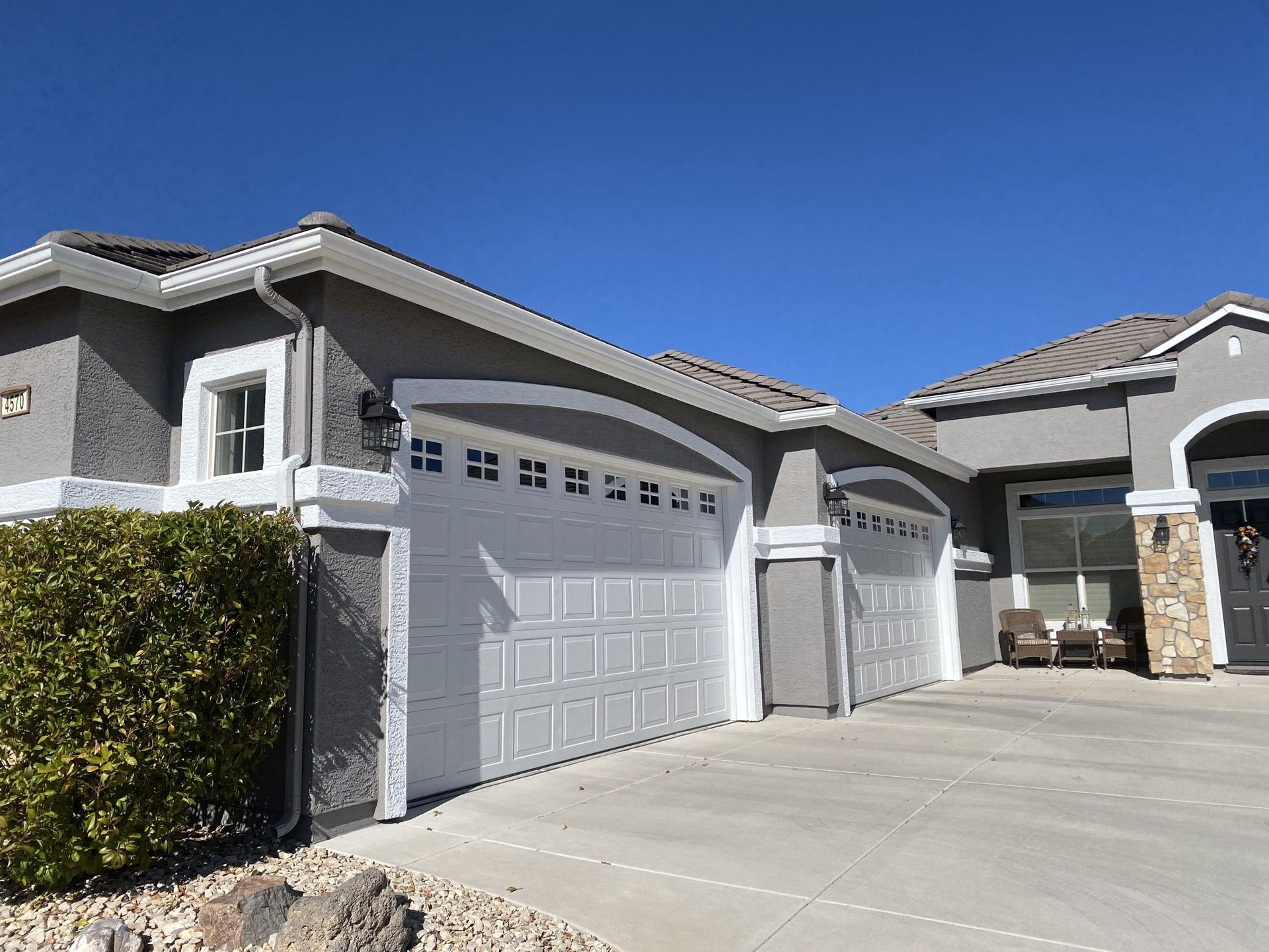 A large house with a lot of garage doors