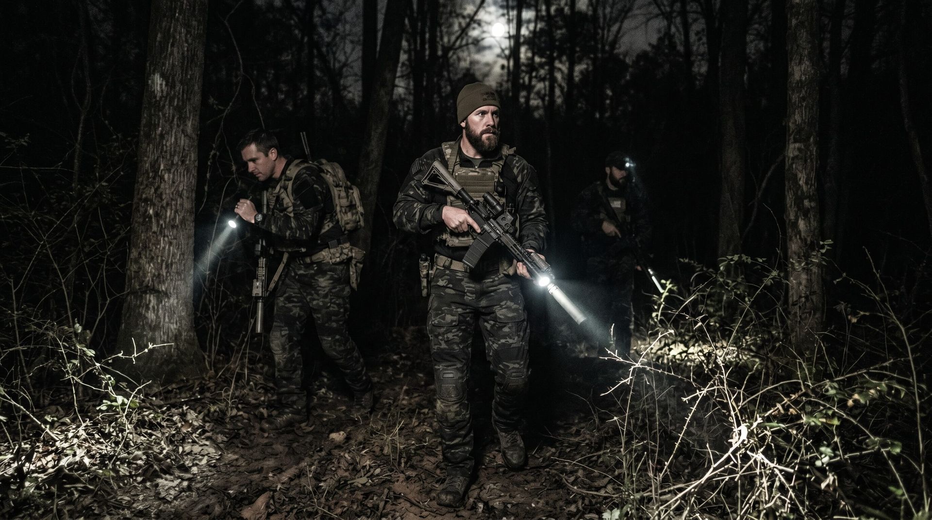3 guys hog hunting at night with flashlights and rifles