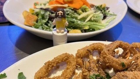 Little Jesus eating Onion Rings