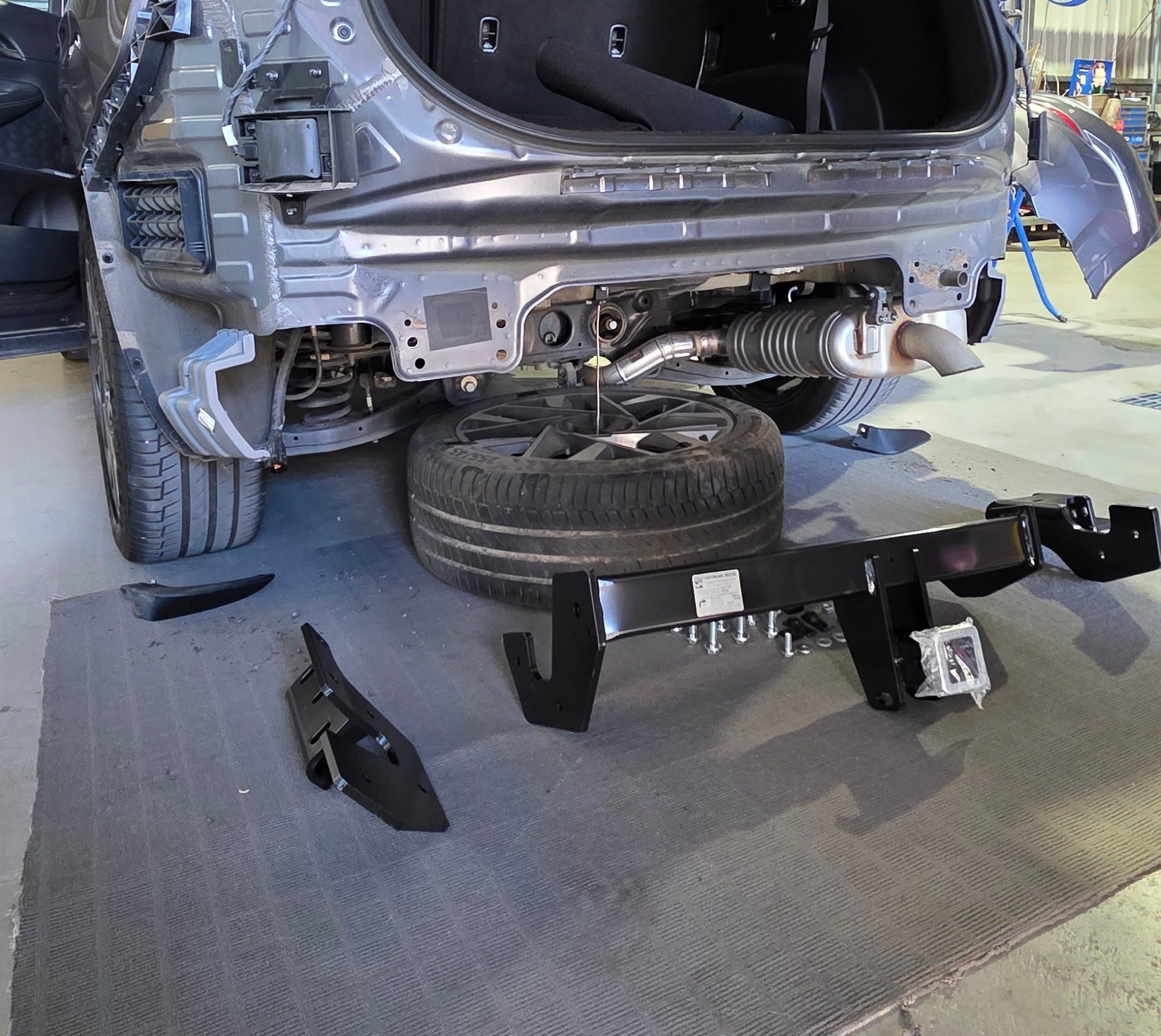 Car's Rear Section, Undergoing Repair, With a New Trailer Hitch — Hinterland Towbars in Tin Can Bay, QLD