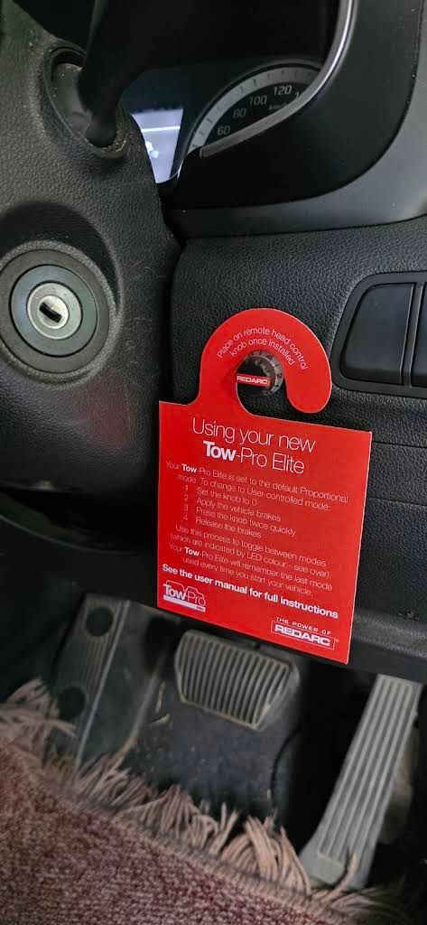Red Instruction Tag for a Redarc Tow-pro Elite Brake Controller — Hinterland Towbars in Cooroy, QLD